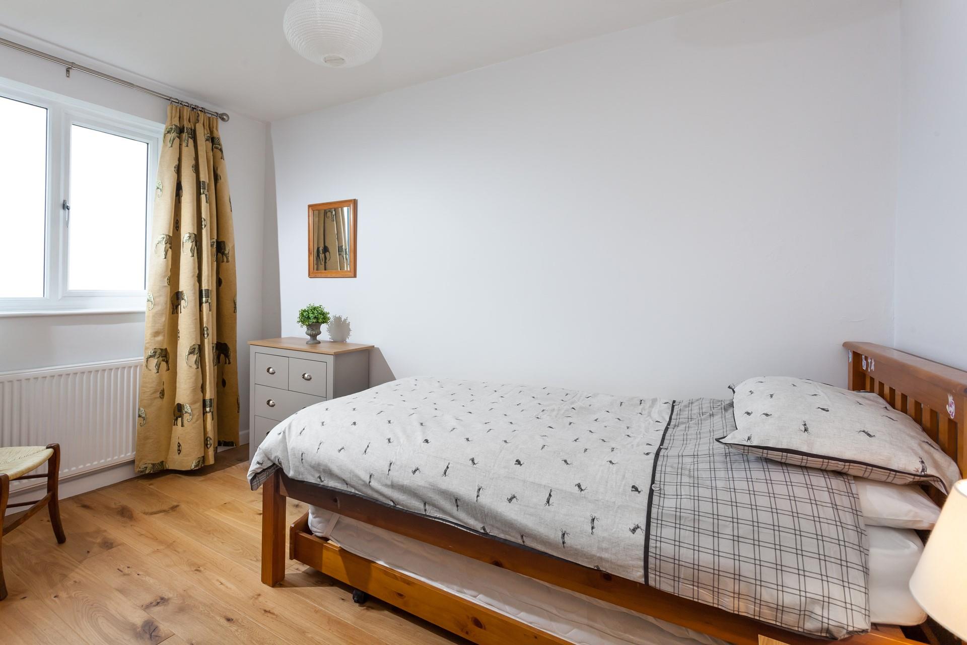 The single bed is perfect for a little one, they'll love the funky elephant curtains!