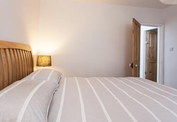 Bedroom 1 has a super spacious king size bed to wake up refreshed each morning.
