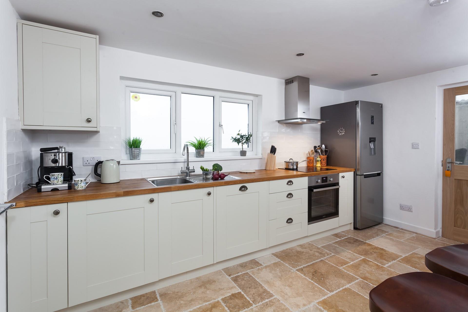 Spacious and fully equipped, the kitchen provides easy cooking opportunities for the chef of the family.