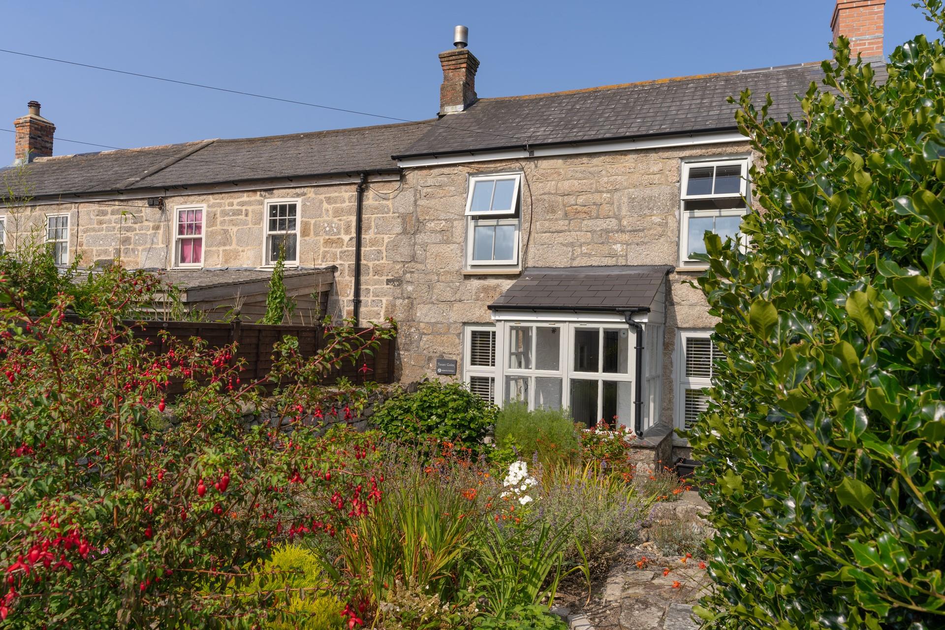 The garden has raised beds and a pond and is a peaceful place to sit and watch the world go around.