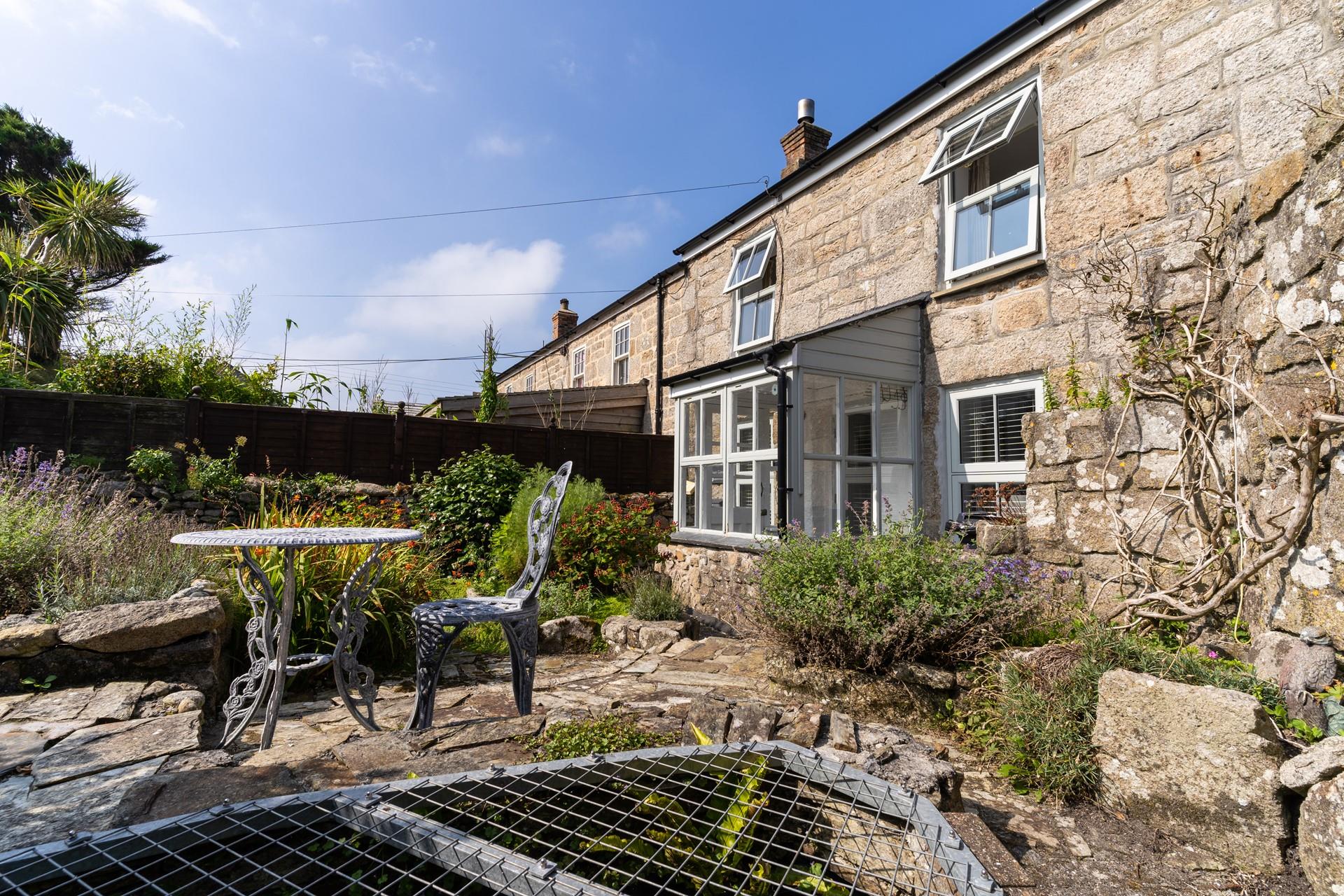 Take a glass of something cold outside in the suntrap garden.