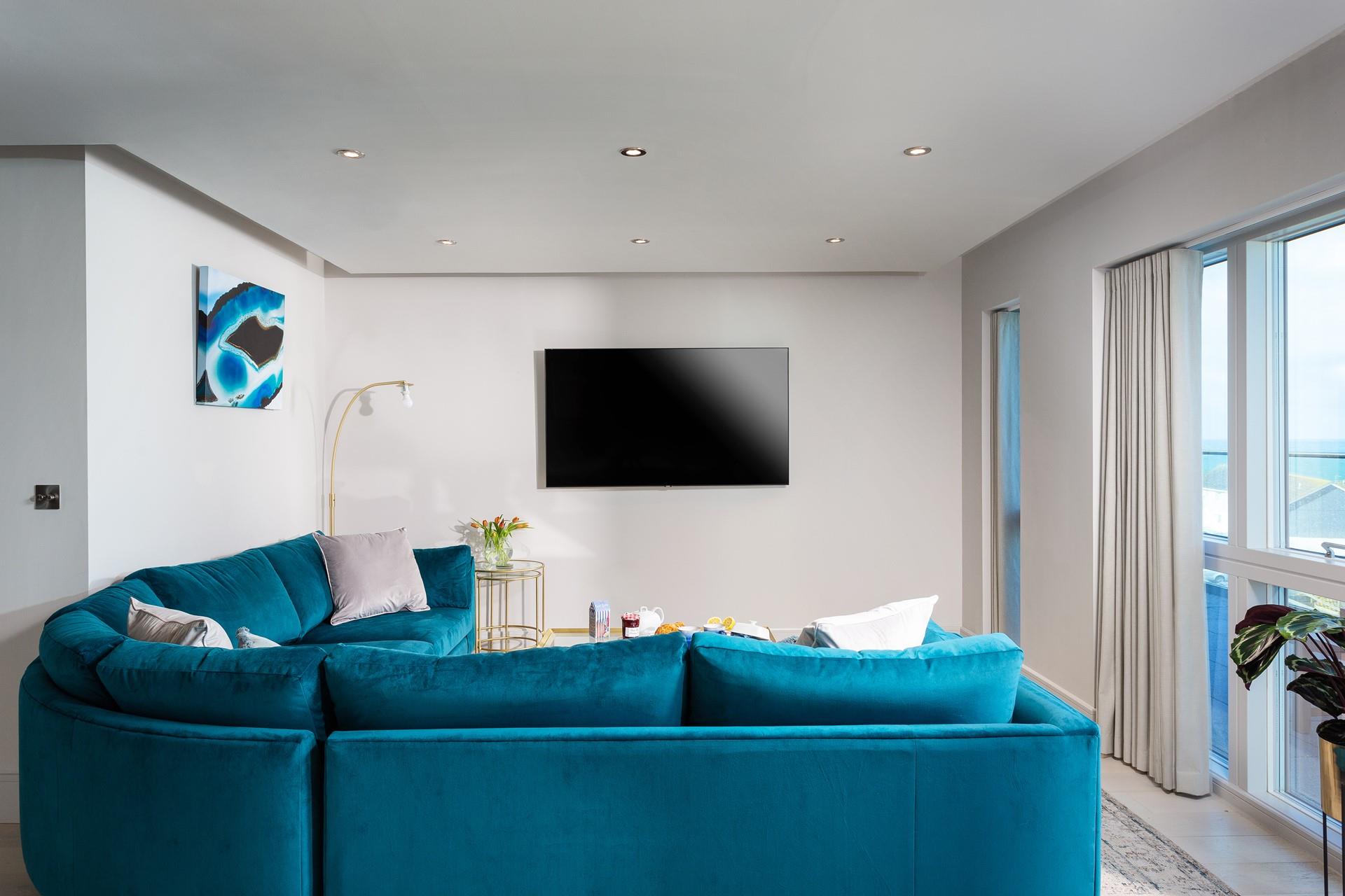 Sink into the soft sofa and enjoy a family film night.