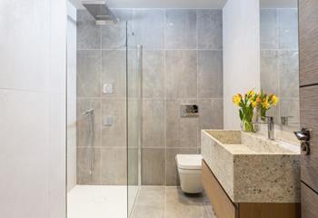 There is a family shower room with a stylish walk-in shower.