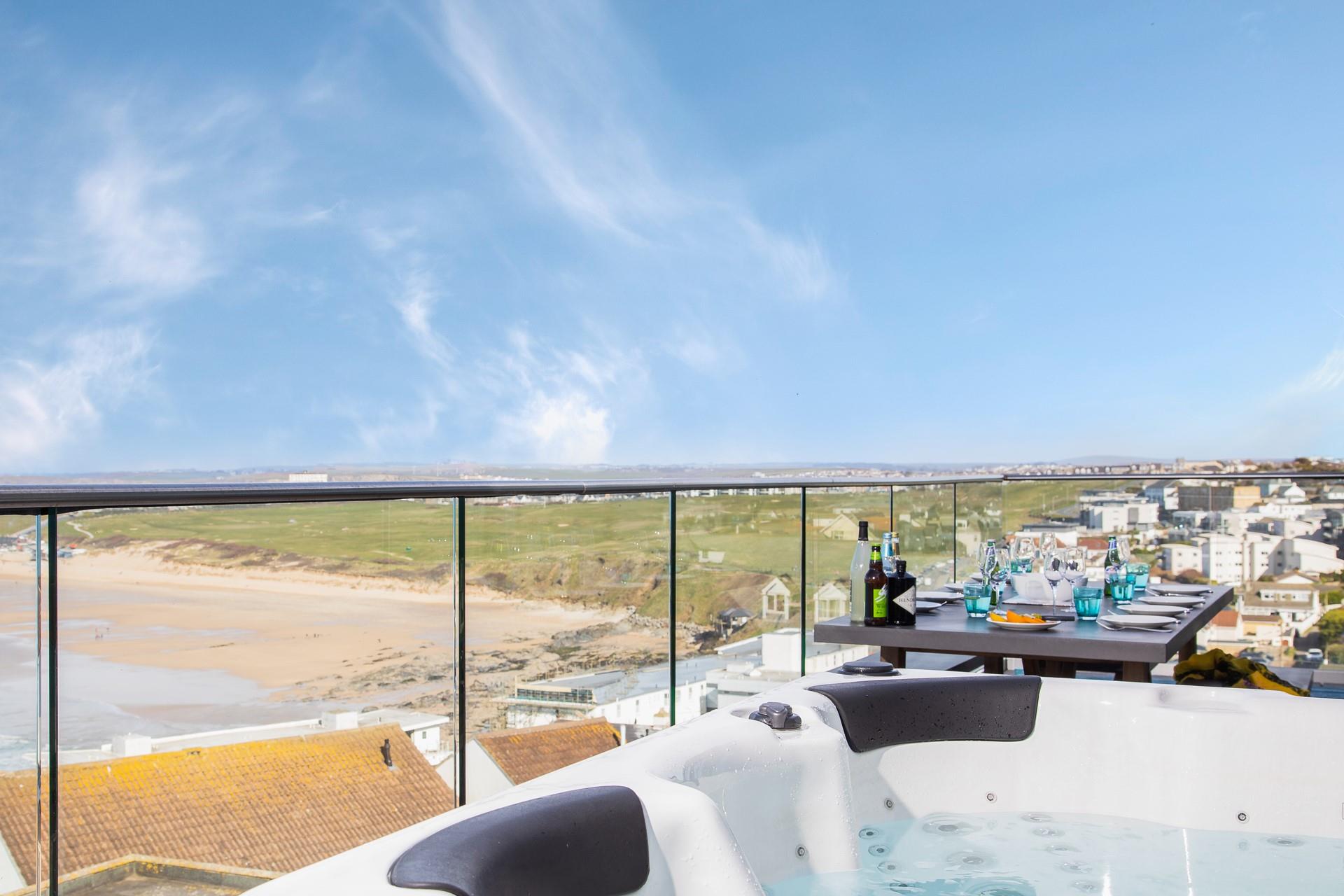 Watch the waves and enjoy the view of the north coast from the hot tub on the balcony.