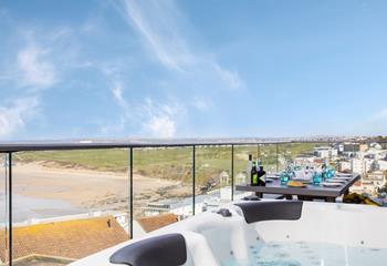 Watch the waves and enjoy the view of the north coast from the hot tub on the balcony.