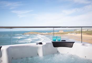 Dip into the hot tub and enjoy the stunning views with a glass of wine in hand.