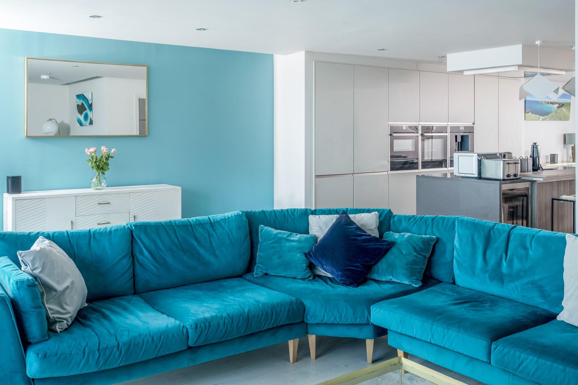 Enjoy a lazy evening on the comfortable sofa after a busy day exploring the nearby beaches. 