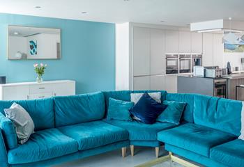 Enjoy a lazy evening on the comfortable sofa after a busy day exploring the nearby beaches. 