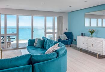 Sink into the plush blue sofa and relax after a day on the beach.