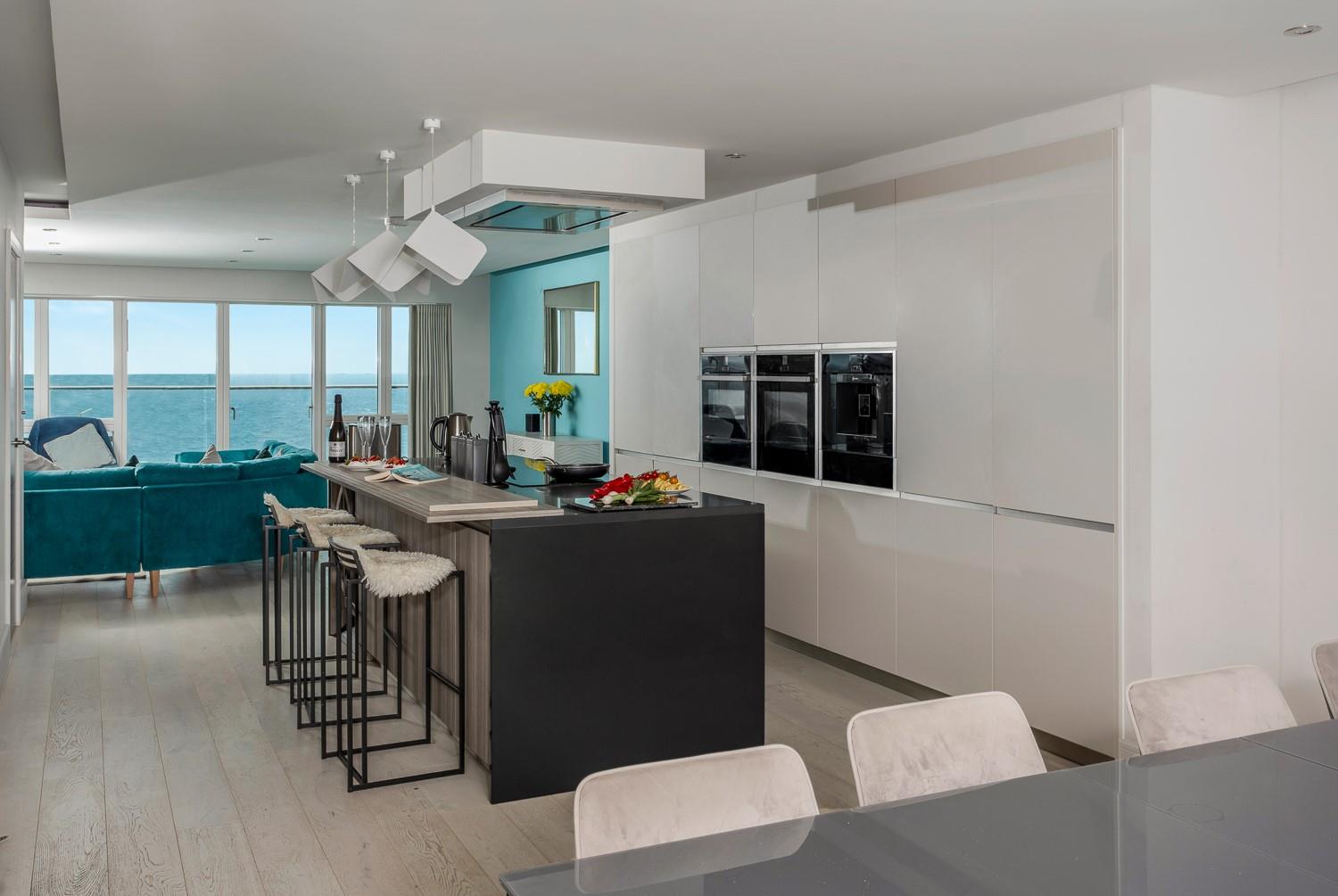 The living space is sociable and light, with balcony doors to both sides so you can let in the fresh Cornish air.