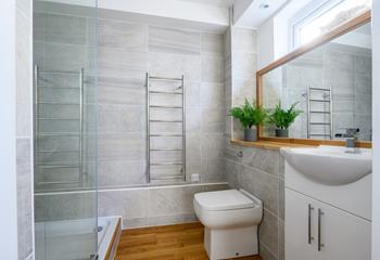 Hop into the rainfall effect shower, before using the large mirror to get ready for the day ahead. 