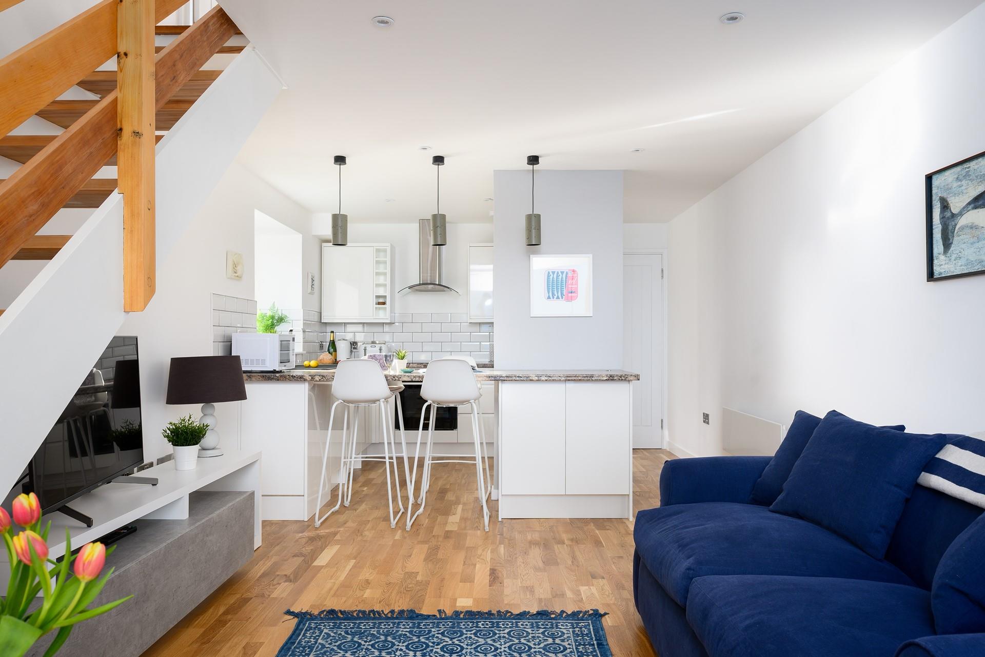 The open plan area downstairs and large windows fill the room with natural light. 