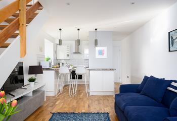 The open plan area downstairs and large windows fill the room with natural light. 