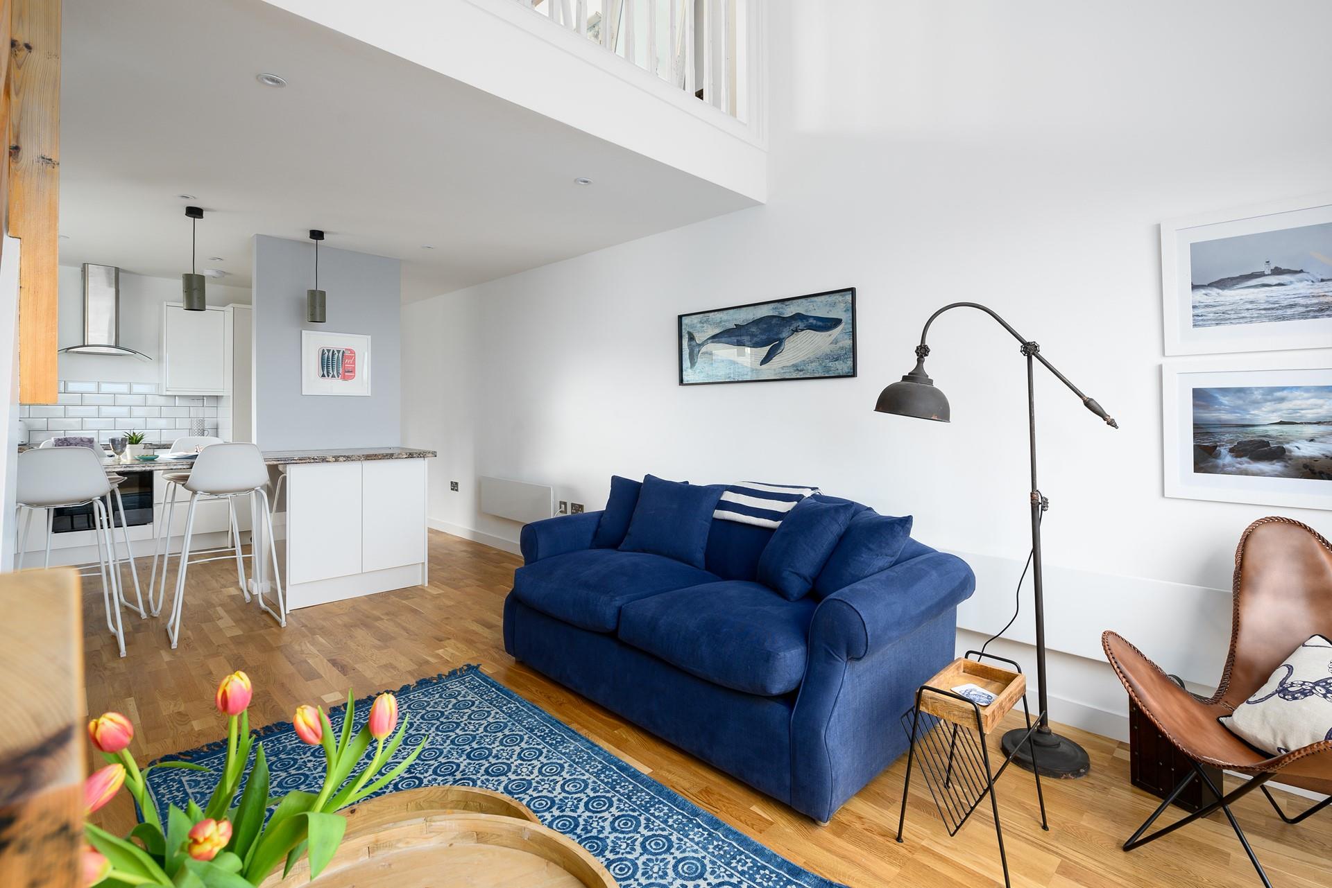 The neutral colours with hints of deep blue provide a relaxing space to lounge in. 