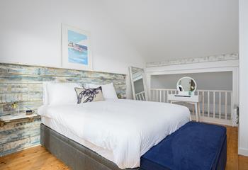 We love the unique bedroom with thoughtful handmade touches, like the stunning driftwood headboard. 