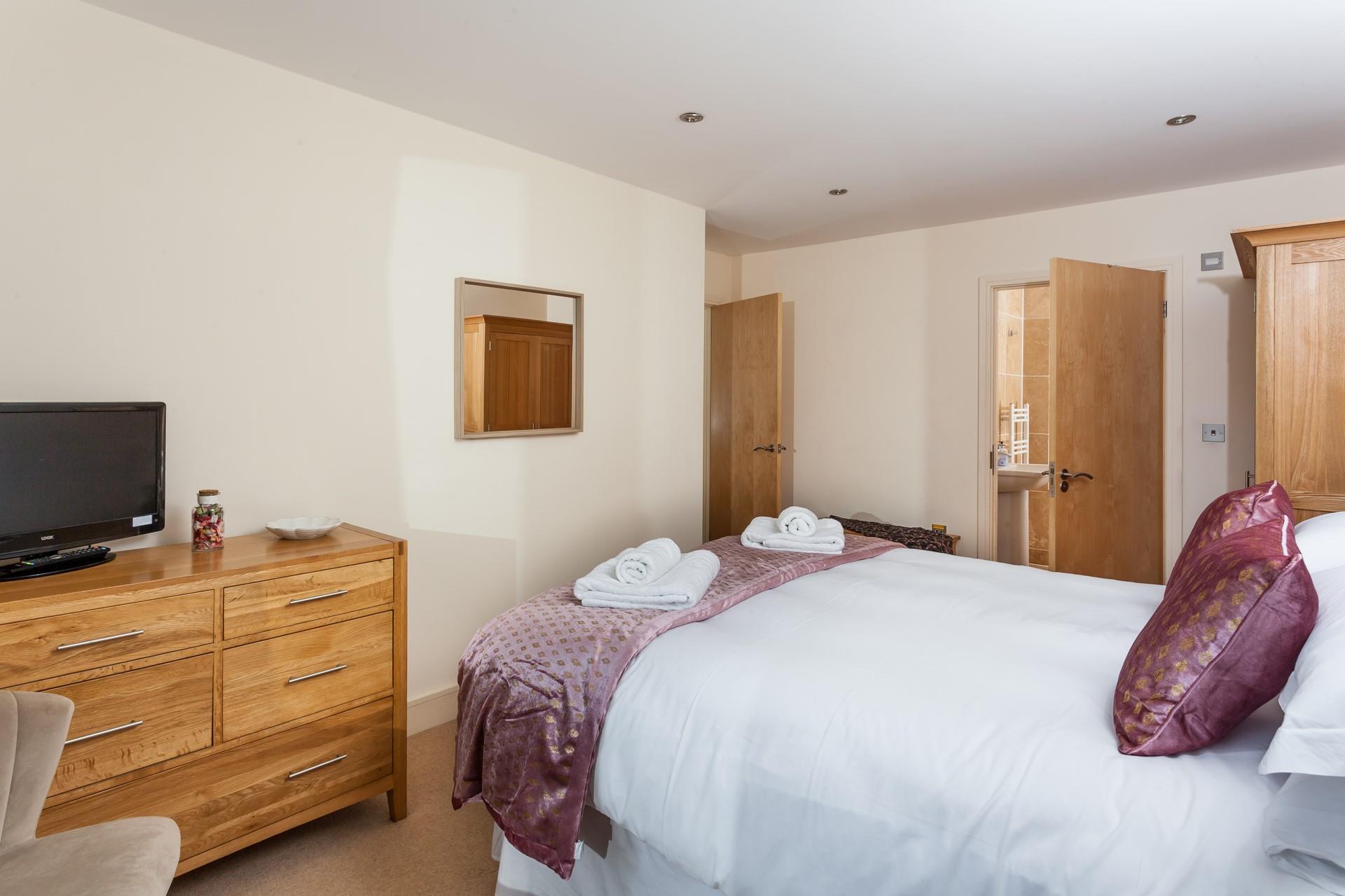 Bedroom 1 has a king size bed and an en suite providing the perfect base to get ready.