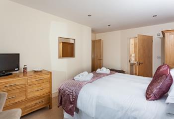 Bedroom 1 has a king size bed and an en suite providing the perfect base to get ready.