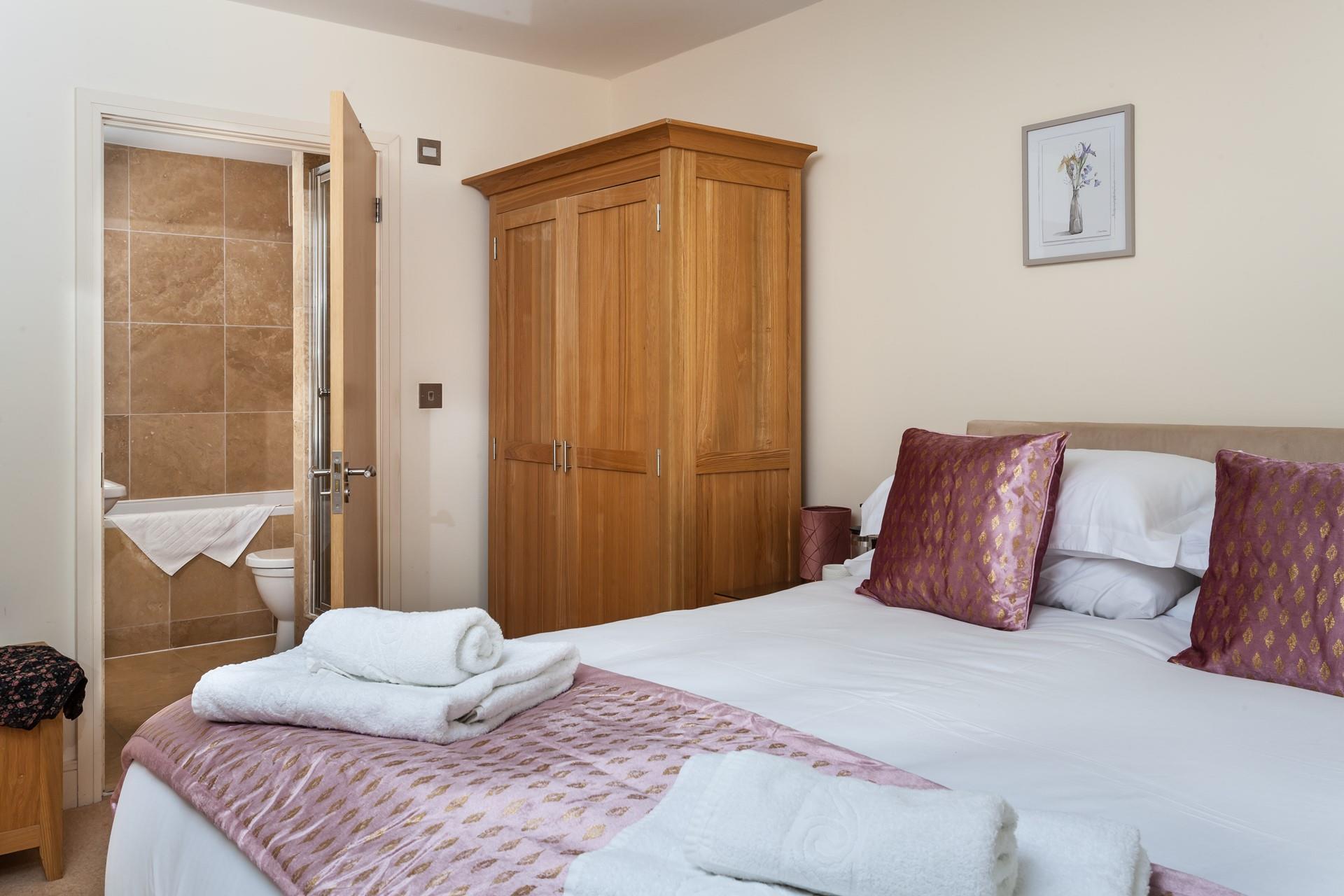 The main bedroom boasts an en suite with a bath and shower, so there will be no queuing to get ready for the day.