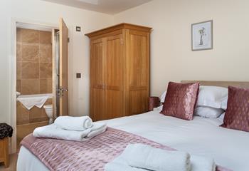 The main bedroom boasts an en suite with a bath and shower, so there will be no queuing to get ready for the day.