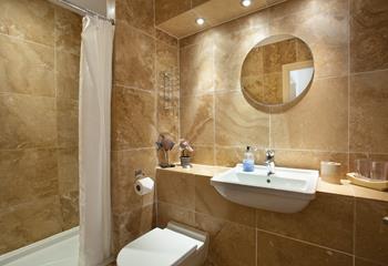 As well as the en suite with a bath, there is a further shower room providing all the amenities needed for a family of four. 