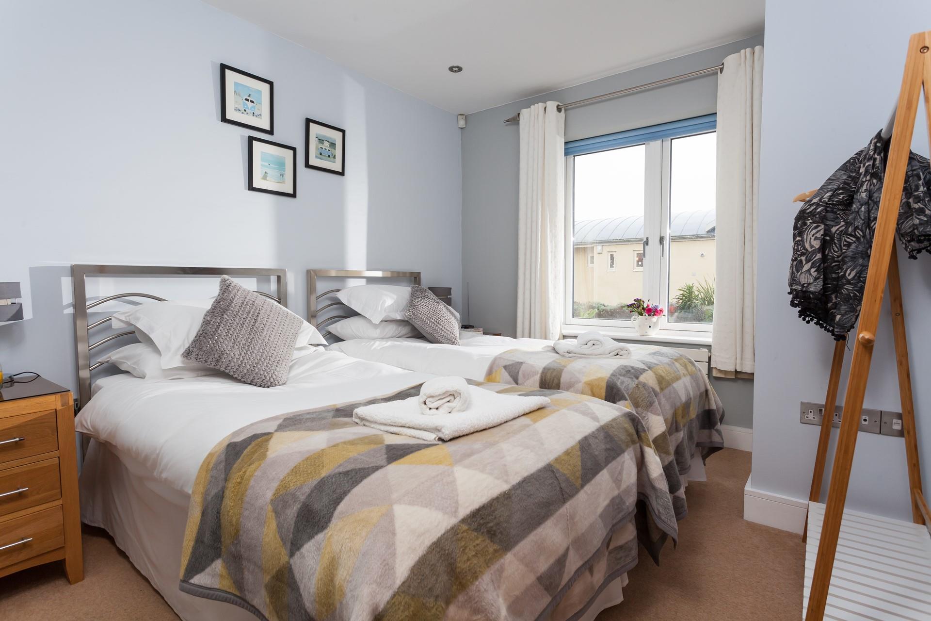 The bedrooms are both at the rear of the building, with comfortable beds for a restful night's sleep.