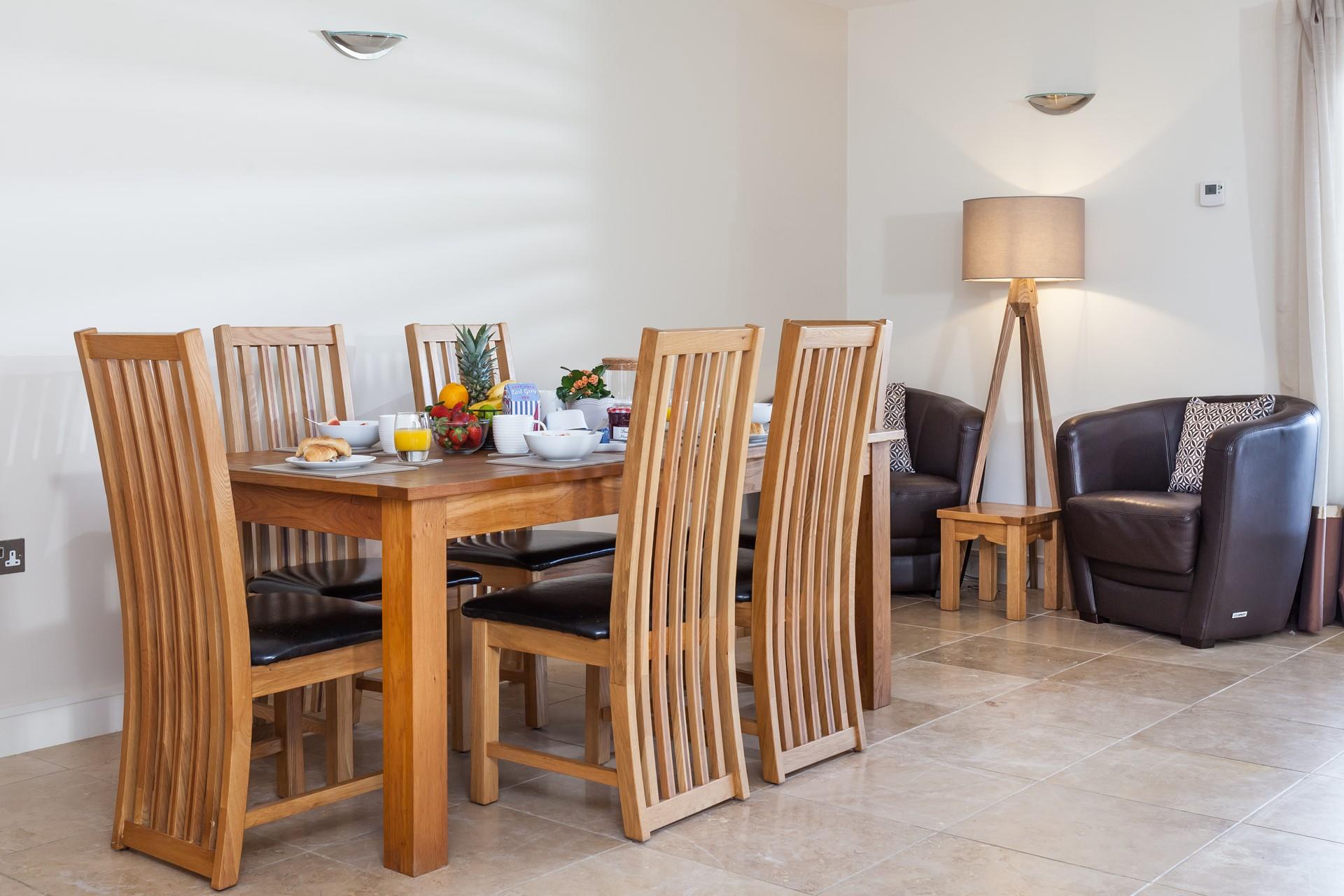 Gather around the dining table and enjoy a meal together as a family.