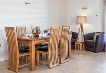 Gather around the dining table and enjoy a meal together as a family.