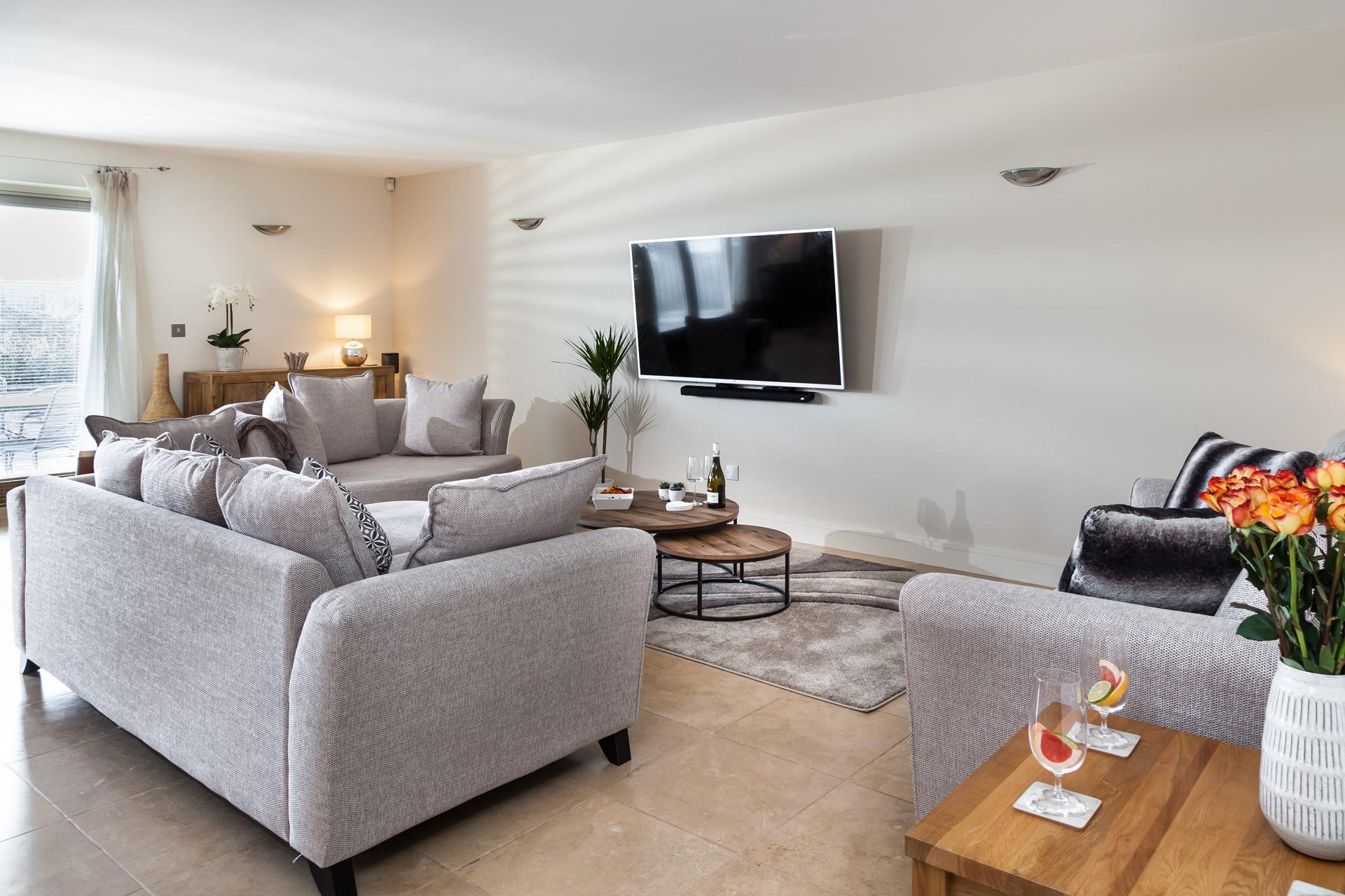 The living area is super cosy, with plenty of room for the whole family to chill out together and watch a film.