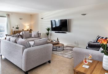 The living area is super cosy, with plenty of room for the whole family to chill out together and watch a film.