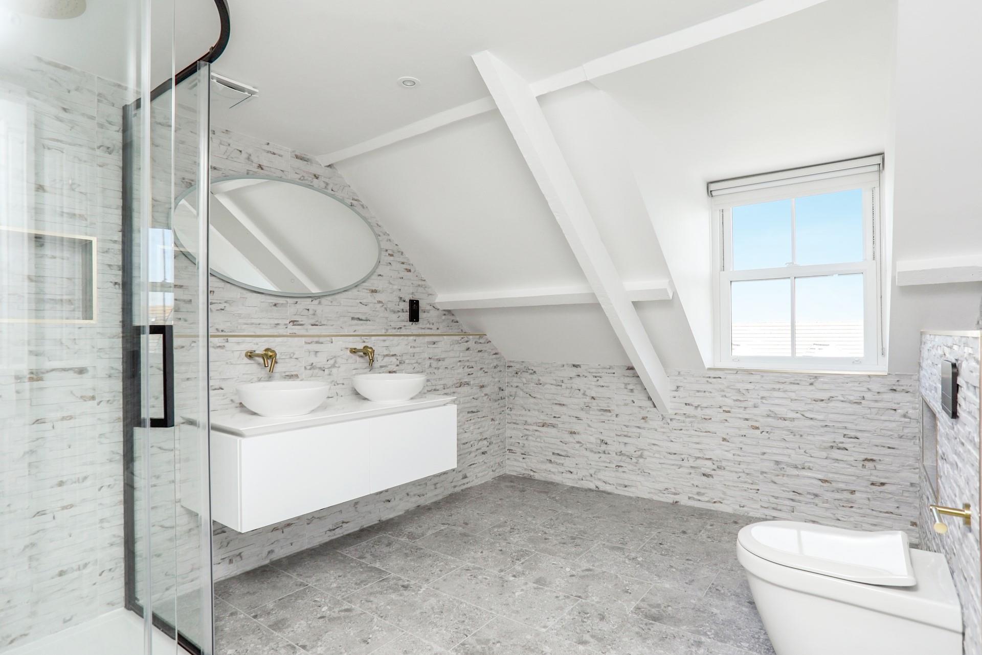 Double sinks are an added bonus in the stylish shower room!