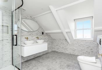 Double sinks are an added bonus in the stylish shower room!