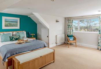 The master bedroom at the top of the house, is spacious and light with views towards the dunes.