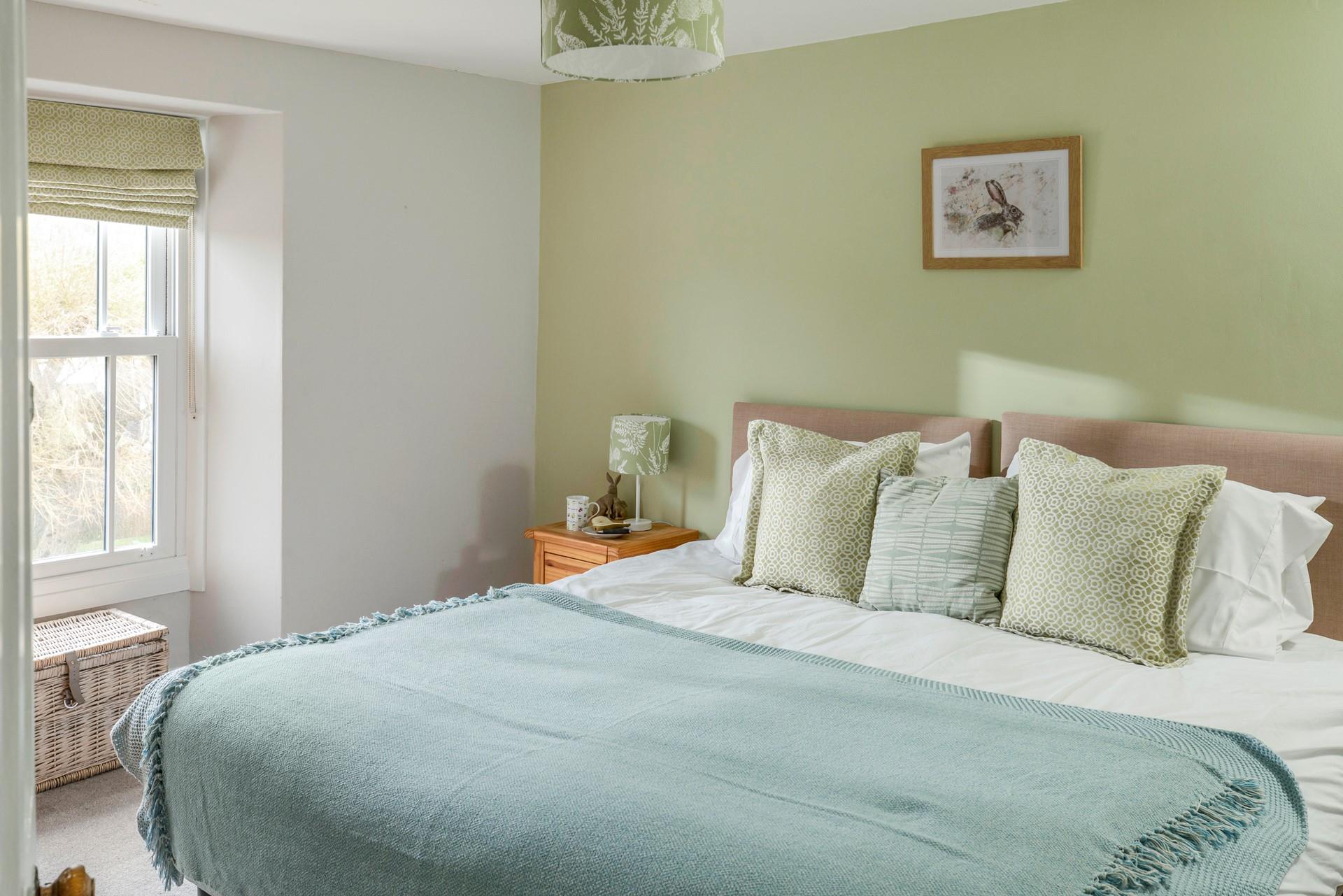 We love the sage green decor in bedroom 2!
