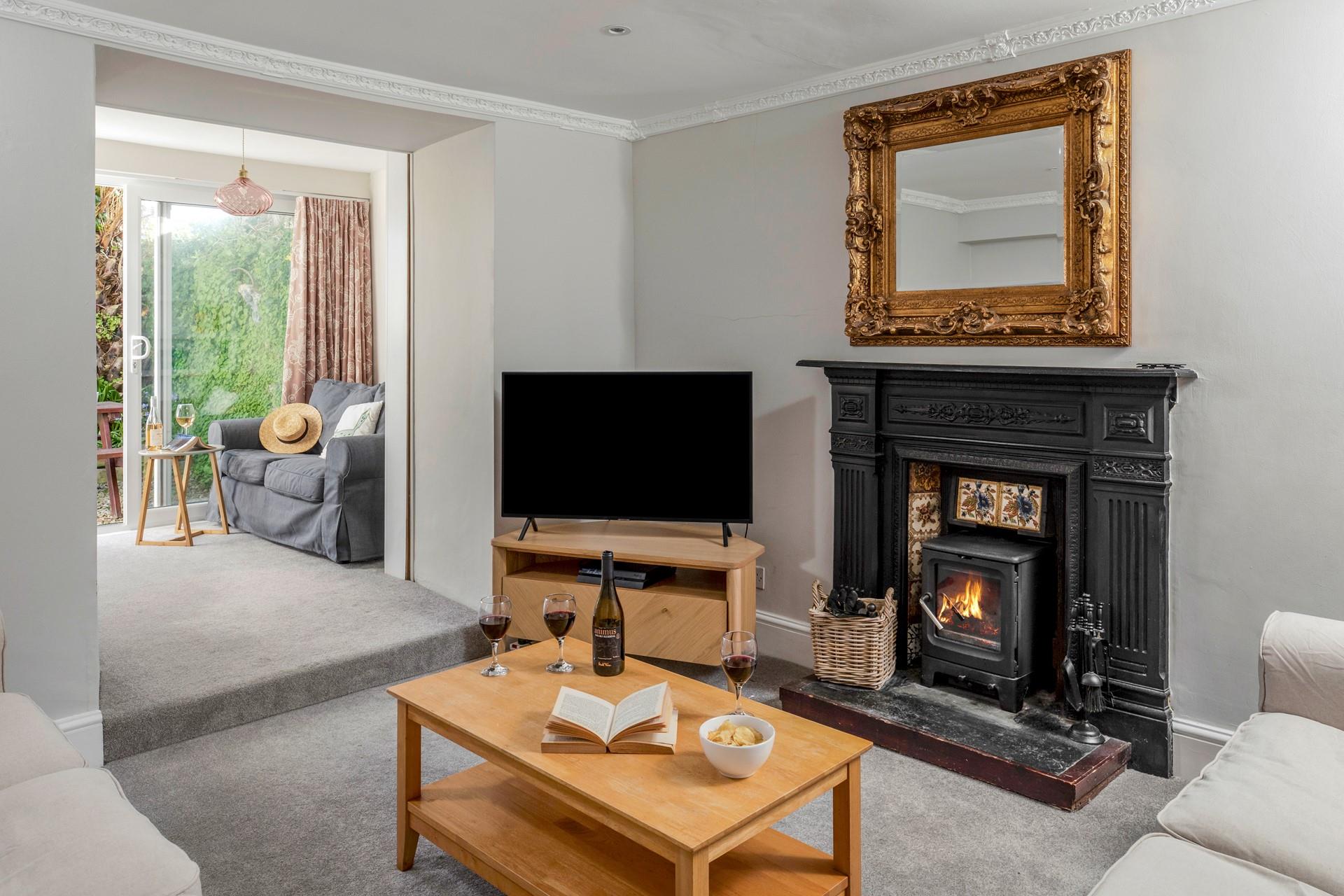 There is a small step up into the sunroom from the main living room, with doors out to the rear garden.