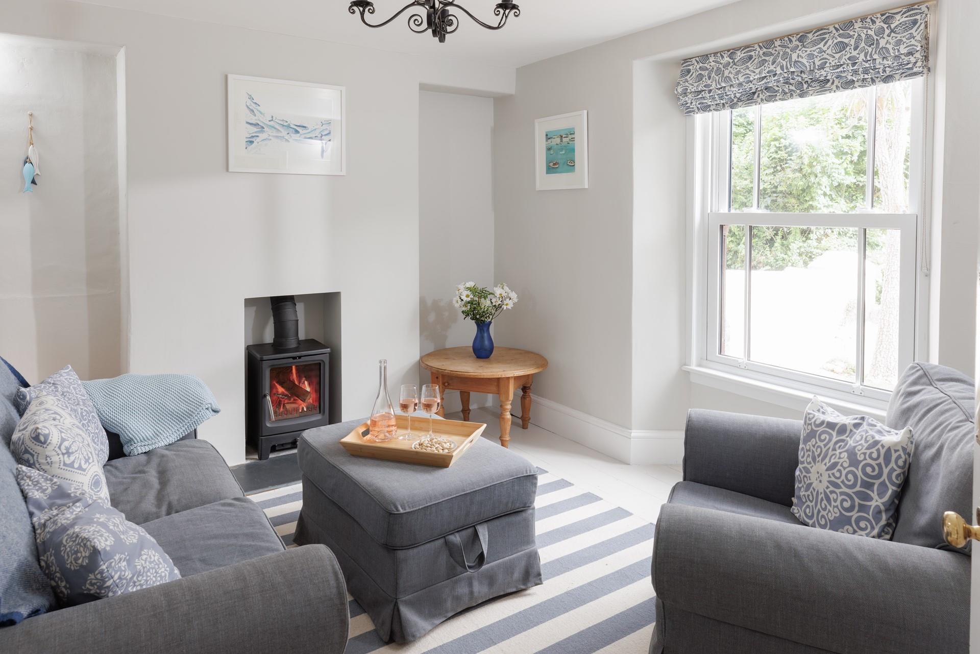 The snug looks out onto the front patio, so you can watch the comings and goings of this popular Cornish village.