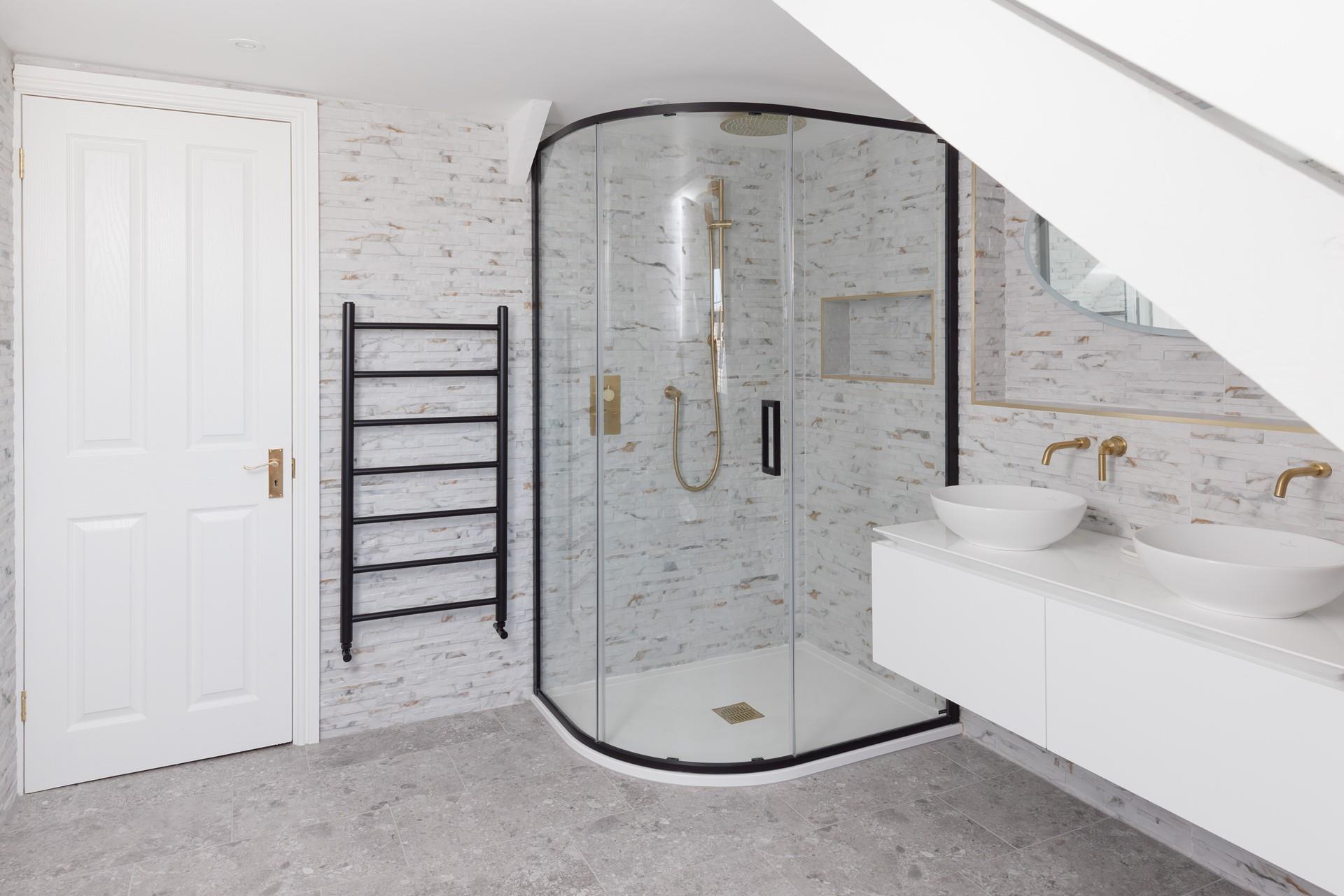 Wash off sandy toes in the stylish shower and take warm, fluffy towels straight from the heated rail.