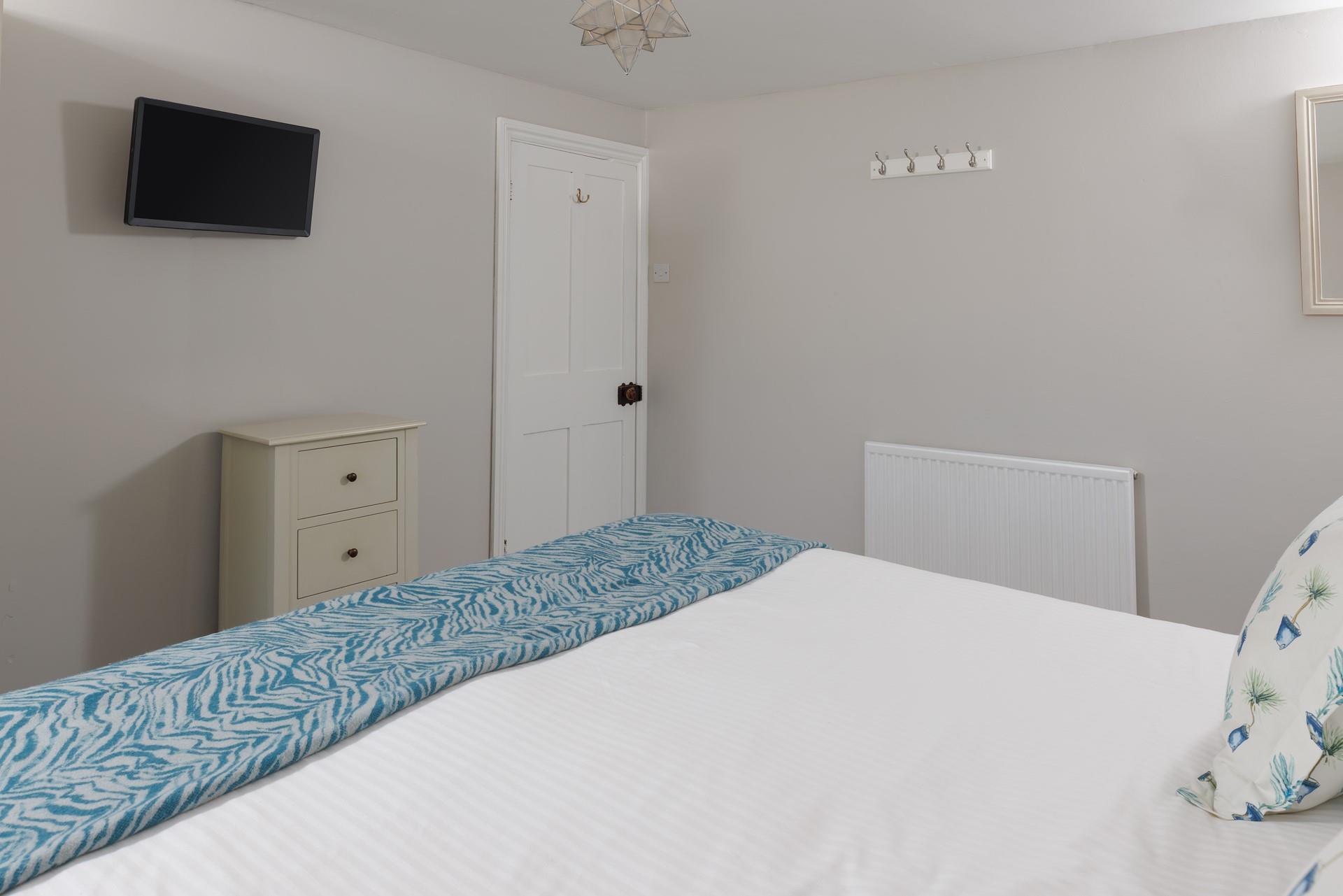 Calming tones await in the bedrooms.