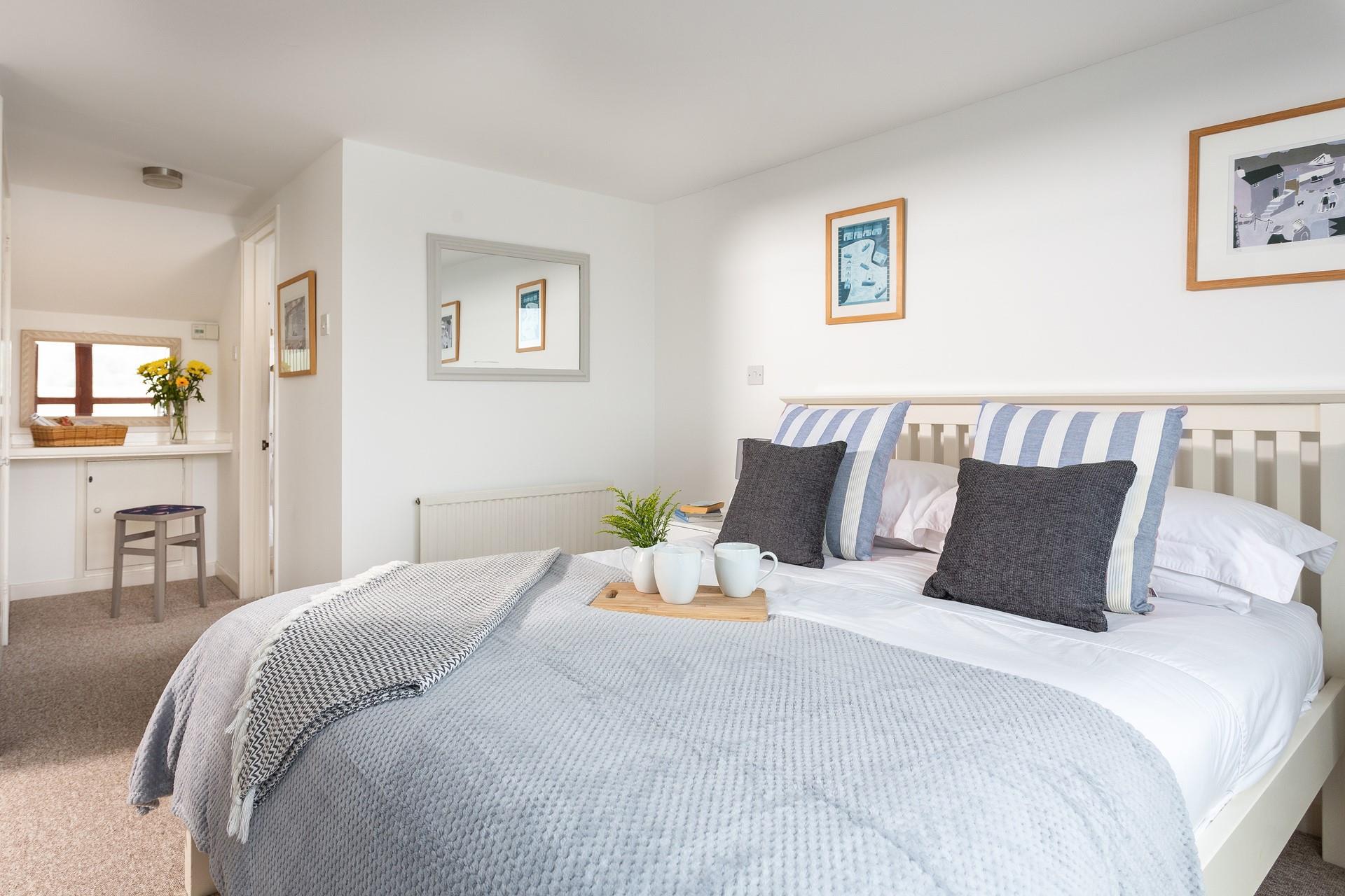 The master bedroom benefits from an en suite shower room, giving everyone space and privacy to get ready.