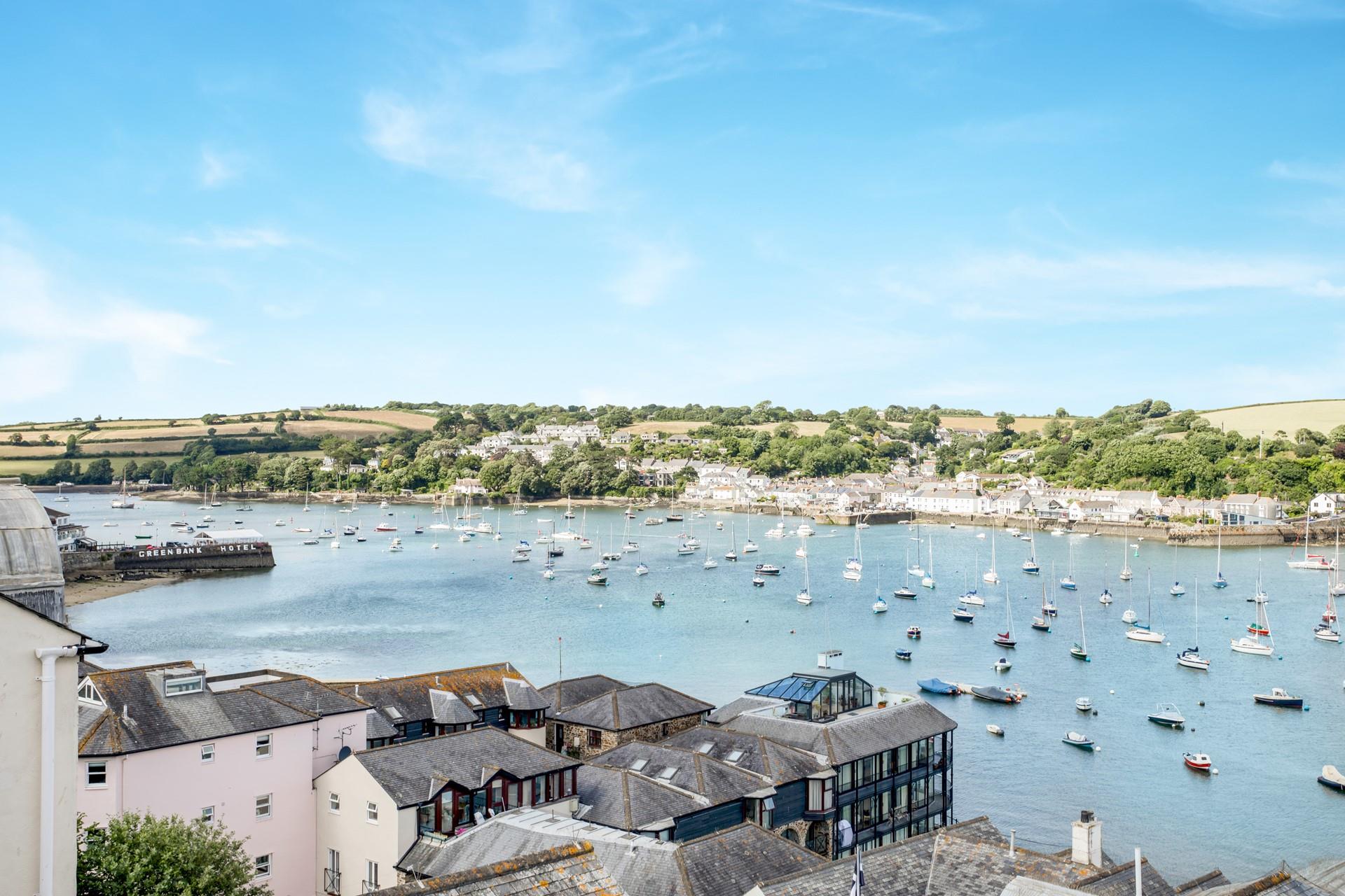 While away the hours, watching the boats sail down the beautiful estuary.