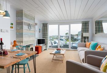 The sitting room leads straight out onto the balcony where you have wonderful sea views.