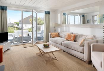 There is plenty of space on the sofa for all the family to relax.