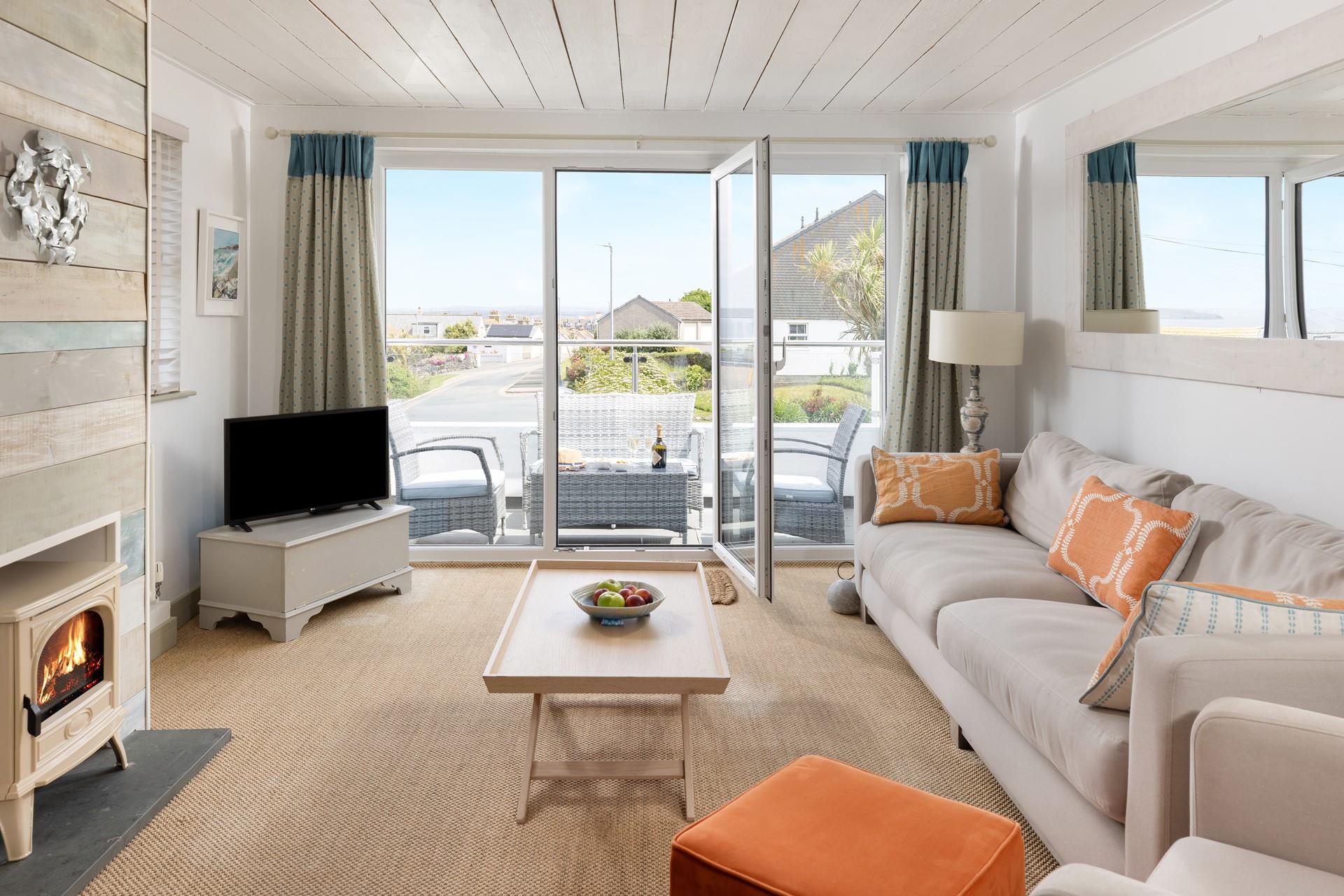 Open the patio doors and enjoy the far-reaching sea view.