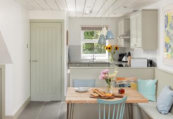 Cook and dine together in the cheerful kitchen and dining space.
