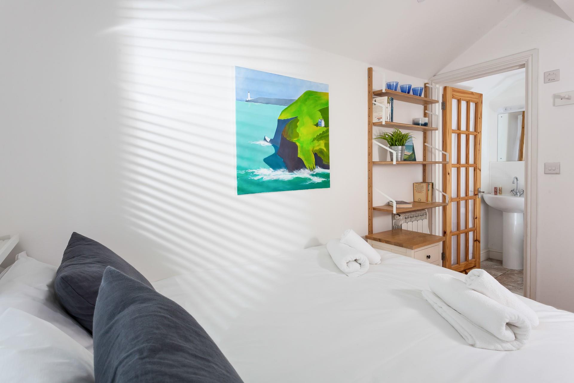 The artwork adds a pop of colour to bedroom 2.