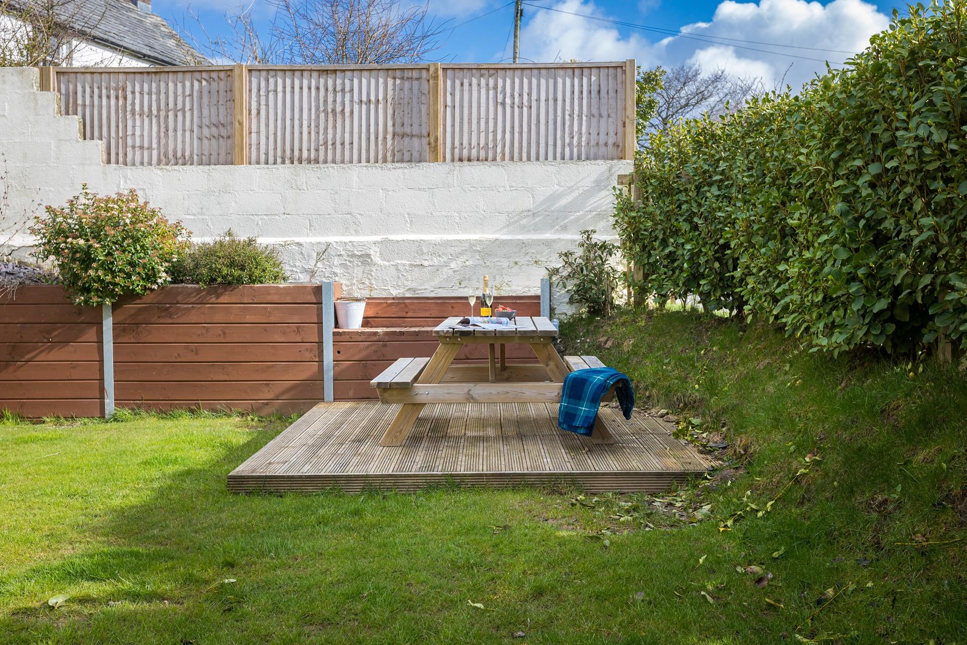 The garden is fully enclosed for children and dogs to play safely.