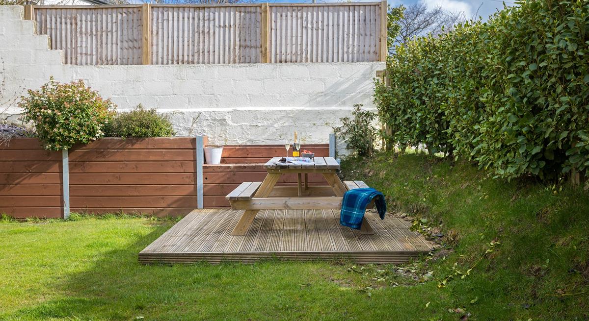 The garden is fully enclosed for children and dogs to play safely.