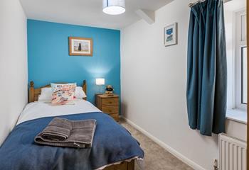 Bedroom 1 has a single bed, perfect for young adults or children.