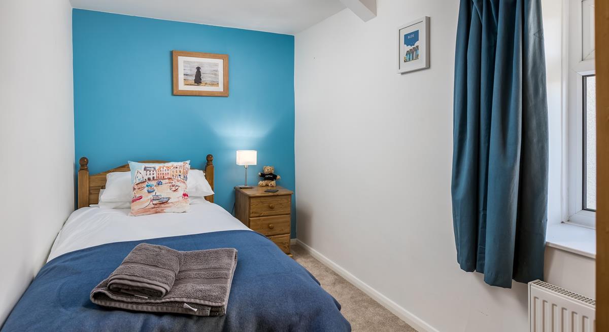 Bedroom 1 has a single bed, perfect for young adults or children.