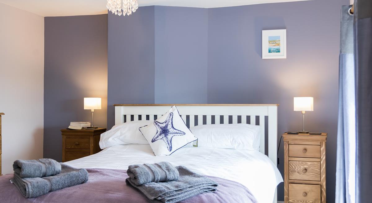 Fluffy towels and soft sheets await in bedroom 3.