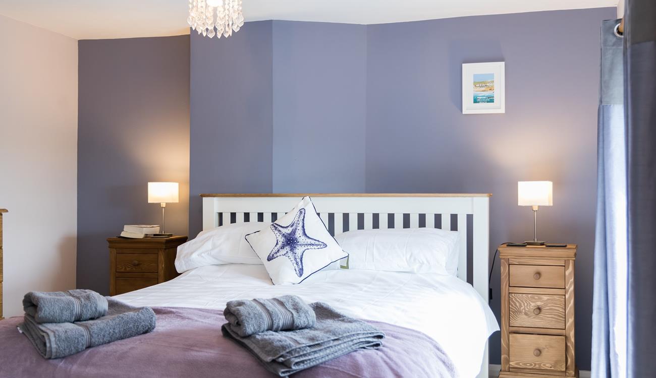 Fluffy towels and soft sheets await in bedroom 3.